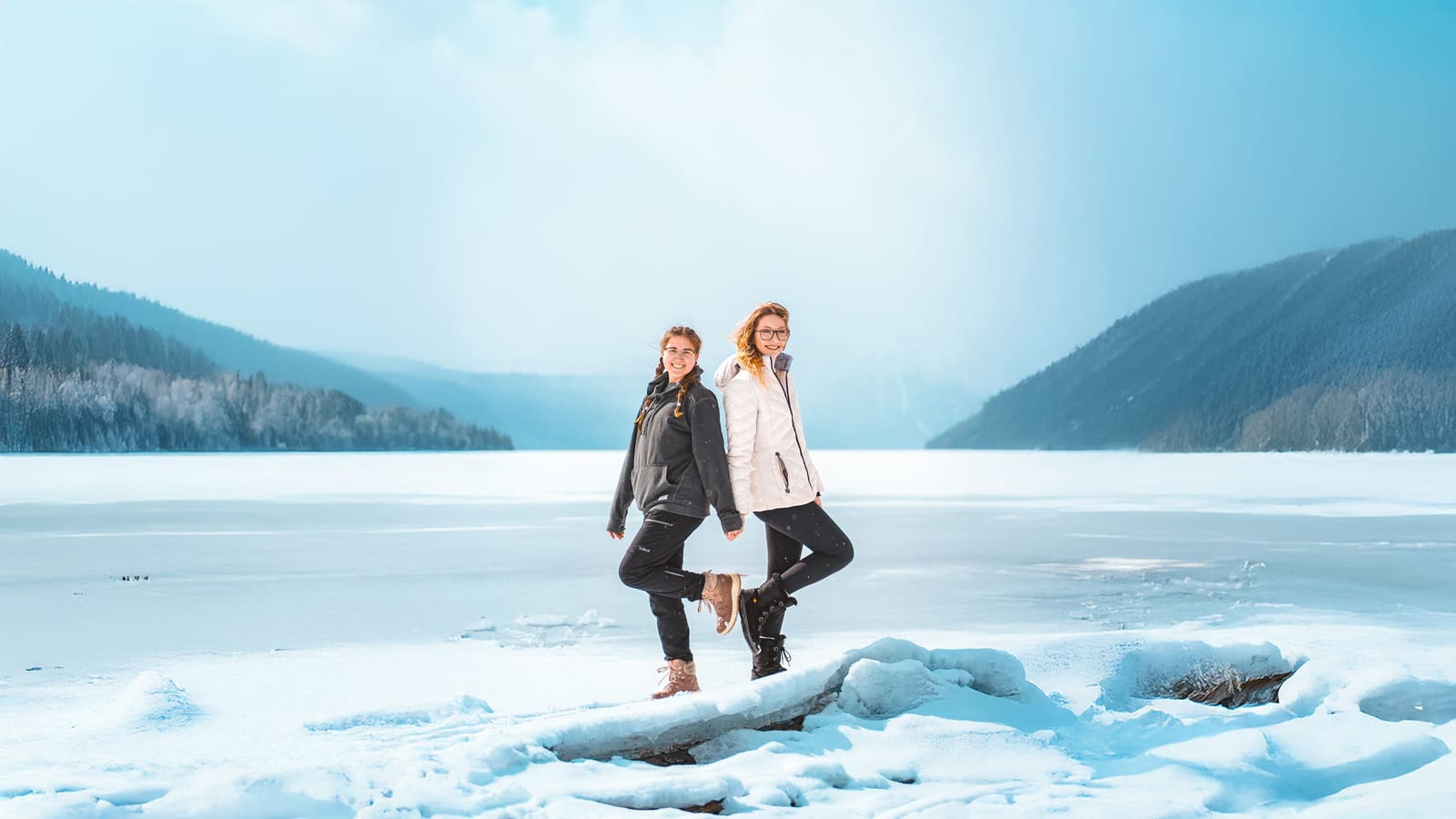 Couple standing on a frozen lake