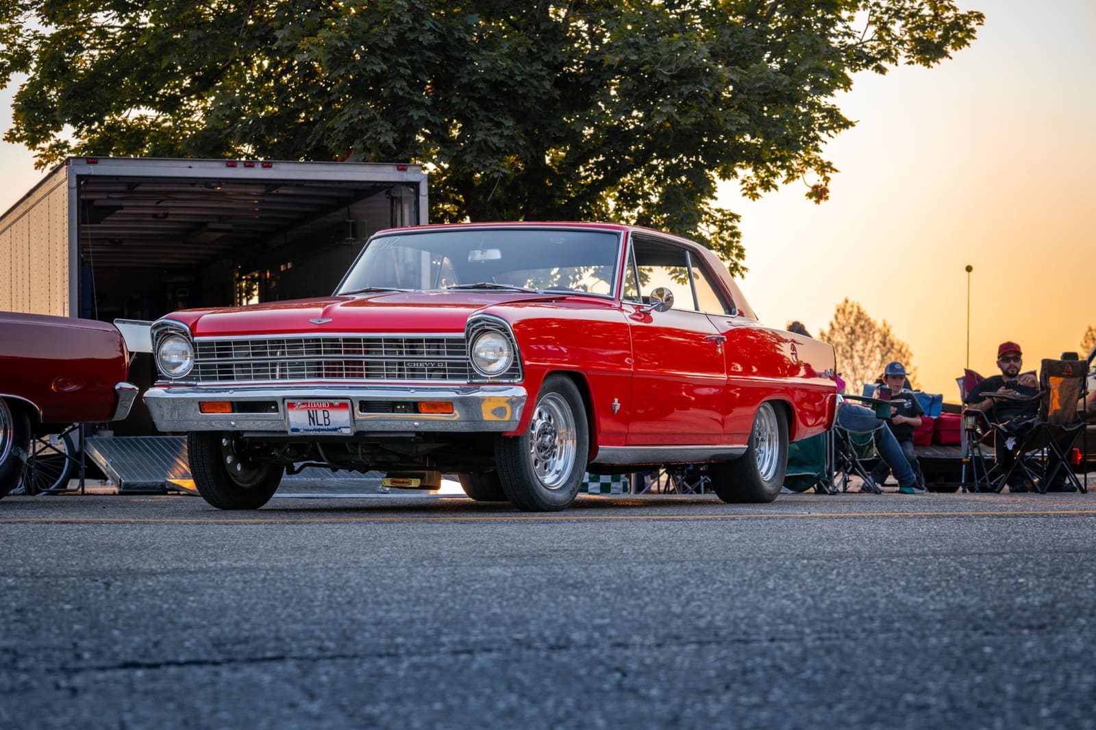 Red classic Chevy Nova at sunset